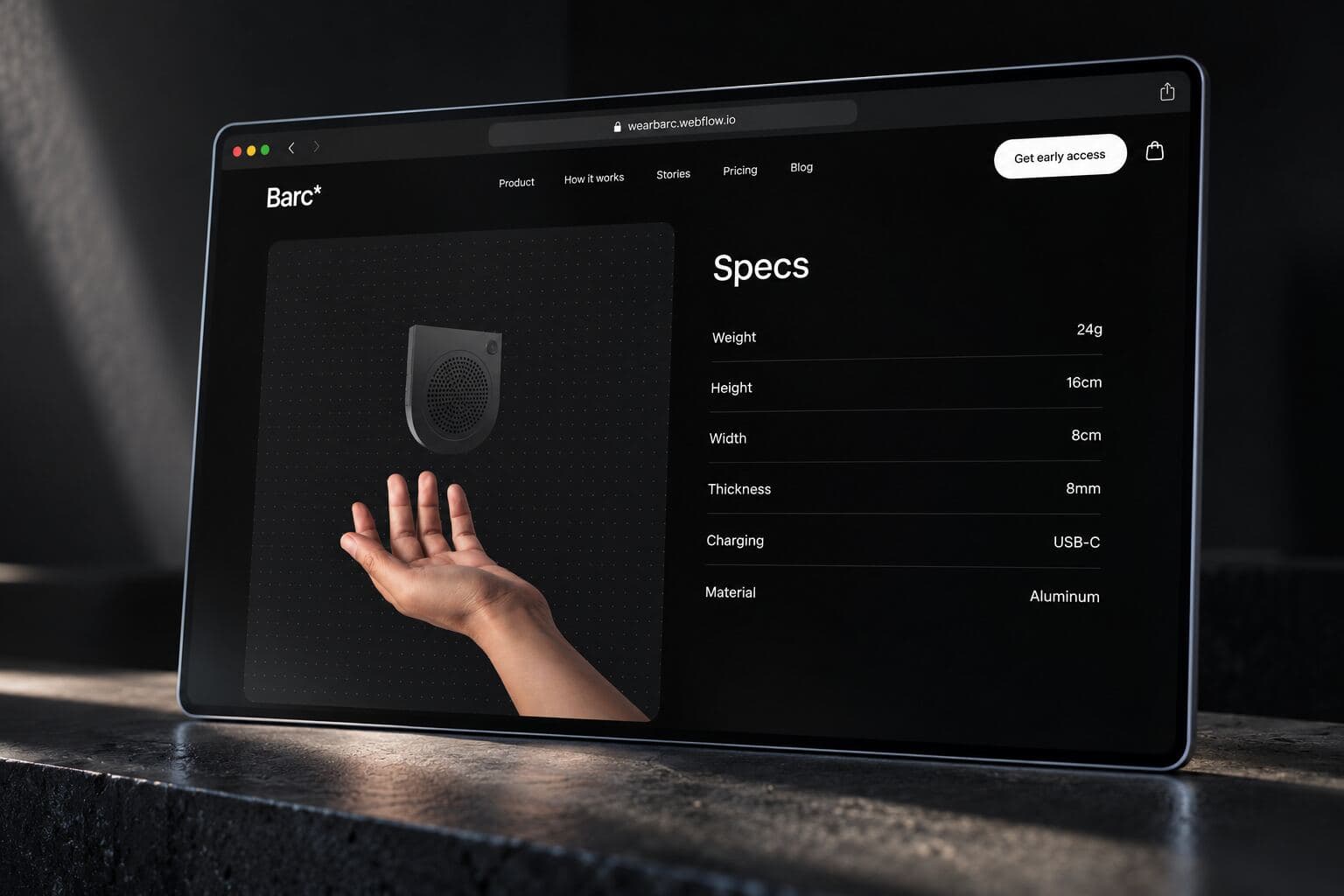 Dark specs section on a tablet: the device over an open hand beside a spec table