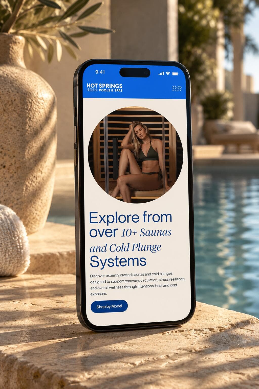 The hub hero on a phone: sans and italic serif headline over a sauna photo